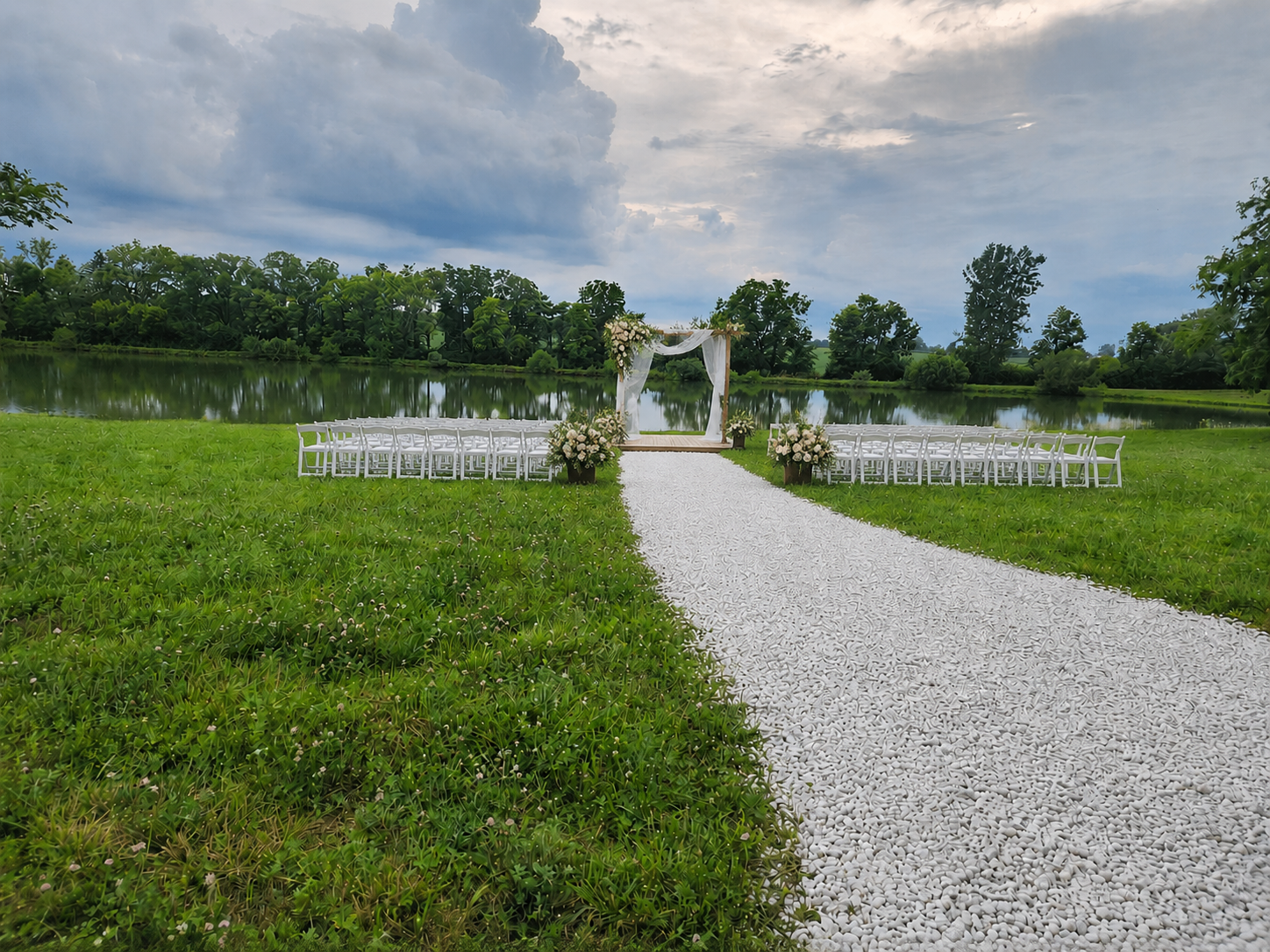 Outdoor wedding ceremony riverside meadow